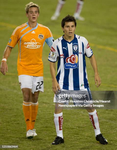 The Houston Dynamo's Stuart Holden and Pachuca's Jose Francisco Torres during the second half of the Concacaf Championship League soccer match at...