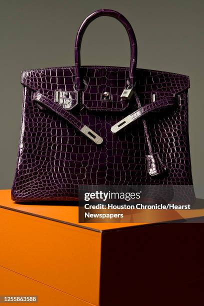 Hermes Birkin handbag with 8.2 carats of diamonds on the bag bag an 1.64 carats of diamonds on the padlock photographed in the Houston Chronicle...