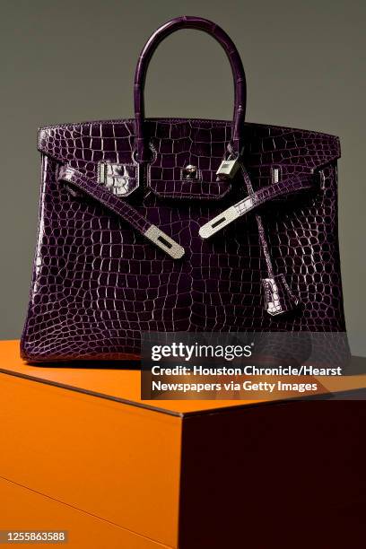 Hermes Birkin handbag with 8.2 carats of diamonds on the bag bag an 1.64 carats of diamonds on the padlock photographed in the Houston Chronicle...
