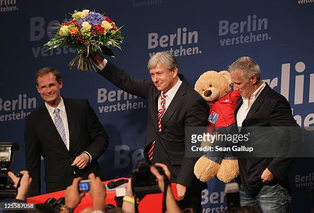Berlin Mayor and incumbent candidate of the German Social Democrats Klaus Wowereit celebrates with his partner Joern Kubicki and Berlin regional SPD...
