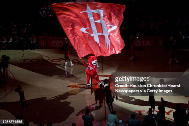 The Houston Rockets mascot Clutch waves a flag before the Rockets face the Portland Trail Blazers at the Toyota Center in the Rockets home opener.
