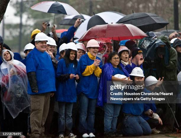 Volunteers and spectators watch as Melissa and Larry Beach's new home from Extreme Makeover: Home Edition is filmed Thursday, Jan. 14 in Kemah.