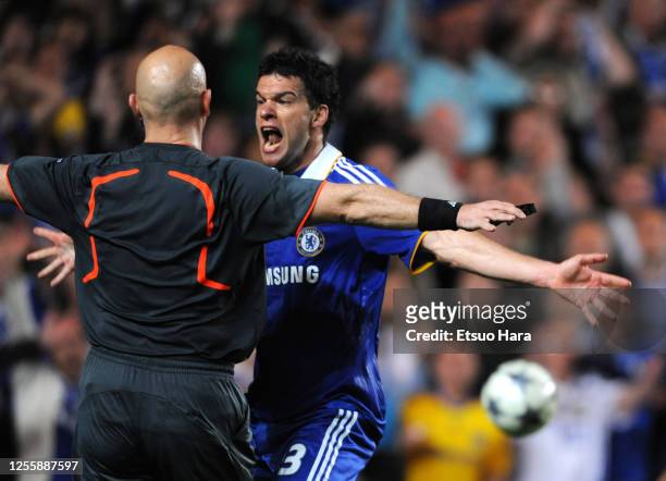 Michael Ballack of Chelsea protests to referee Tom Henning Ovrebo during the UEFA Champions League semi final second leg match between Chelsea and...