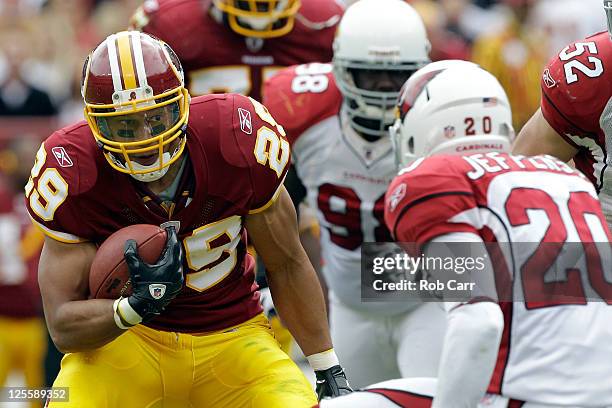 Running back Roy Helu of the Washington Redskins rushes the ball in front of defender A.J. Jefferson of the Arizona Cardinals during the first half...