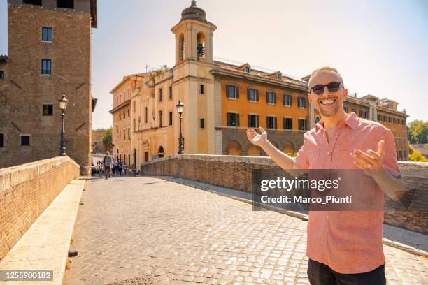 men visit italy - rome tiber island - rome tourist stock pictures, royalty-free photos & images