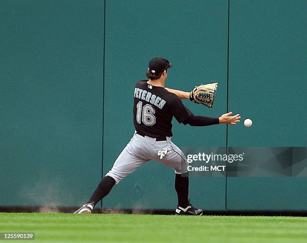 Florida Marlins center fielder Bryan Petersen plays a double off the centerfield wall hit by Washington Nationals left fielder Jonny Gomes during the...