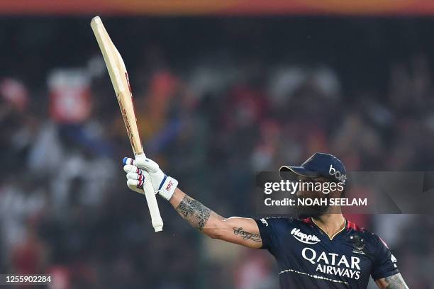 Royal Challengers Bangalore's Virat Kohli celebrates after scoring a half-century during the Indian Premier League Twenty20 cricket match between...