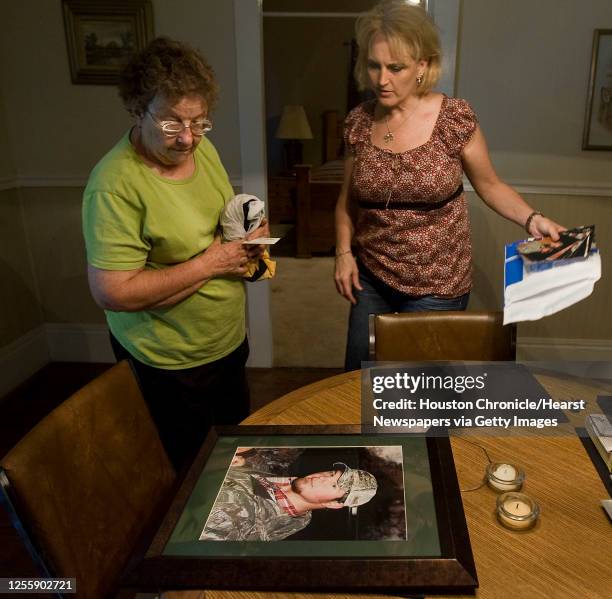 Adam Weise's grandmother Nelda Winslette and his girlfriend Cindy Shelton look at photograph of Weise who was a Transocean employee that was killed...
