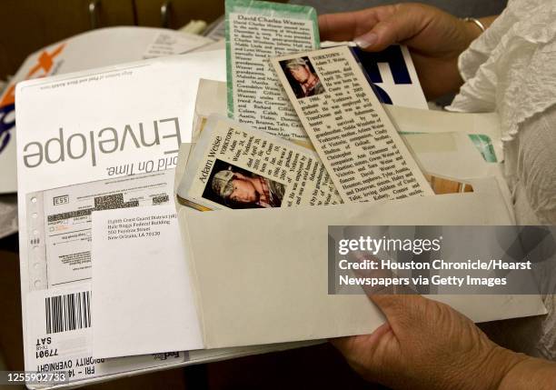 Arleen Weise holds the FedEx envelope from the Coast Guard with information on her son Adam Weise and his obituary, Weise a Transocean employee was...