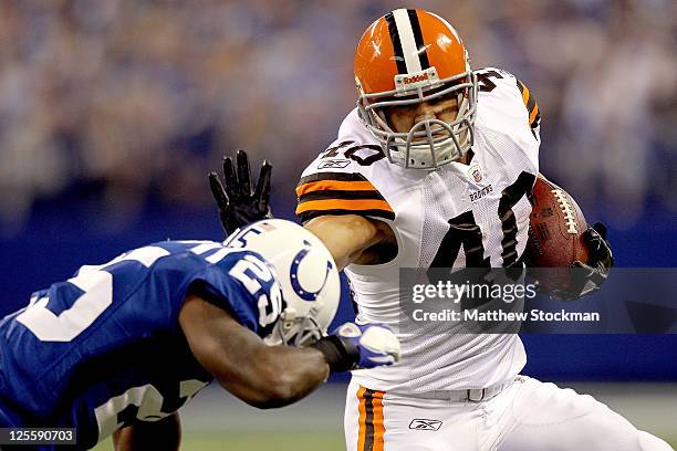 Peyton Hillis of the Cleveland Browns carries the ball against Jerraud Powers of the Indianapolis Colts at Lucas Oil Stadium on September 18, 2011 in...