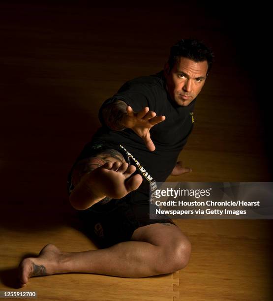 Jason David Frank owner of Rising Sun Karate poses for a portrait Thursday, June 17 in Houston .