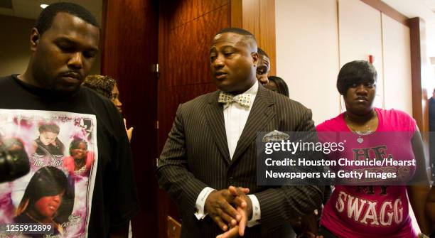 Shatavia Anderson's father Leroy Anderson activist Quanell X and Shatavia Anderson's mother Keisha Lambert speak with the media after a hearing for...