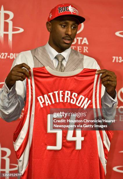 The Houston Rockets first round draft pick Patrick Patterson holds up his jersey during a press conference introducing Patterson at the Toyota Center...