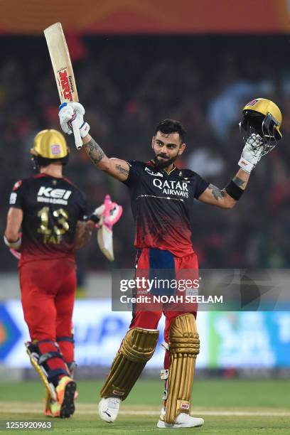 Royal Challengers Bangalore's Virat Kohli celebrates after scoring a century during the Indian Premier League Twenty20 cricket match between...