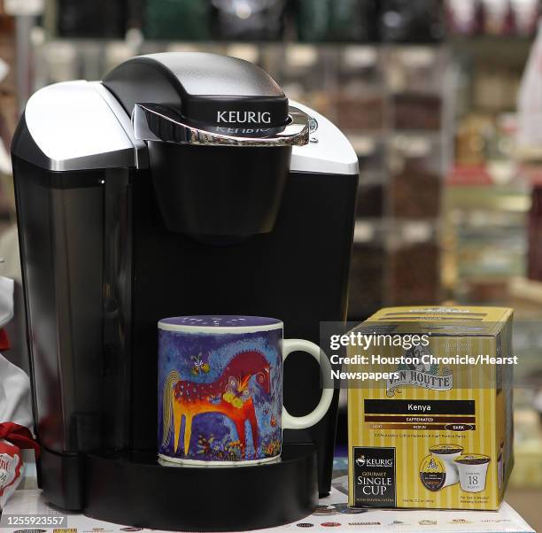 Keuring Special Edition Brewing System coffee maker with a Laurel Burch "Mystical Mare" ceramic coffee mug and a box of Van Houtté Cafe Kenya gourmet...