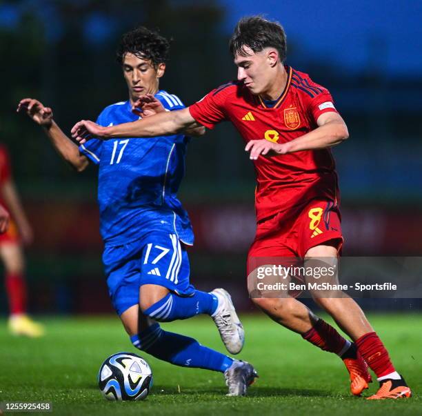 Javier Fernández González of Spain is tackled by Francesco Crapisto of Italy during the UEFA European Under-17 Championship Finals 2023 Group B match...