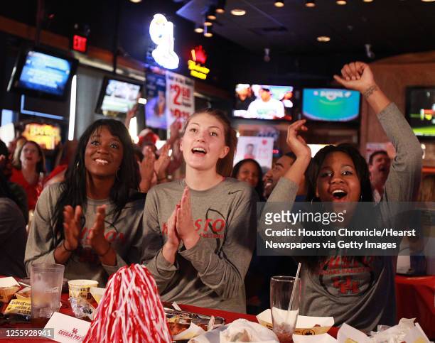 The University of Houston women's basketball team's left to right, Zalika Dyson and Breana Williams watch the NCAA tournament selection on television...