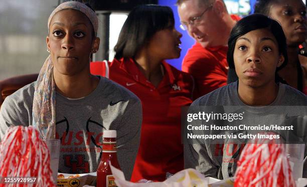 The University of Houston women's basketball team's Brittany Mason left, and Courtney Taylor right watch the NCAA tournament selection on television...