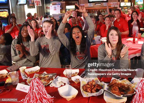 The University of Houston women's basketball team's left to right, Zalika Dyson, Breana Williams and Mae Woods watch the NCAA tournament selection on...