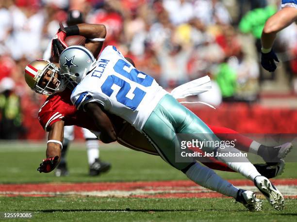 Braylon Edwards of the San Francisco 49ers catches a pass against Abram Elam of the Dallas Cowboys at Candlestick Park on September 18, 2011 in San...