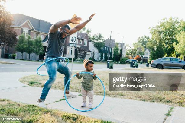 fun learning outdoor activities for 1-year-olds - plastic hoop stock pictures, royalty-free photos & images