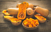 Fresh butternut squash on the wooden table