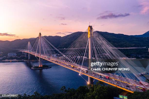 hong kong ting kau bridge in sunset - lantau stock pictures, royalty-free photos & images