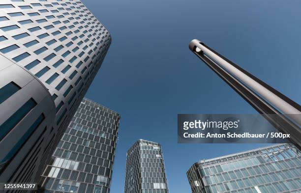 low angle view of modern buildings - anton schedlbauer stock-fotos und bilder