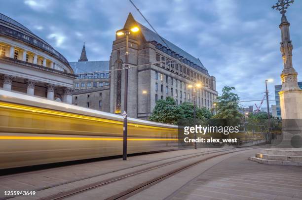 manchester city center trams and city life. - manchester grande manchester imagens e fotografias de stock