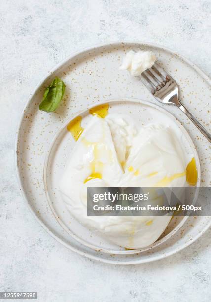 high angle view of italian cheese burrata - burrata stock pictures, royalty-free photos & images