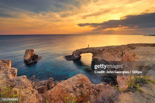 scenic view of coastline at sunset, ayia napa, republic of cyprus - agia napa stock-fotos und bilder