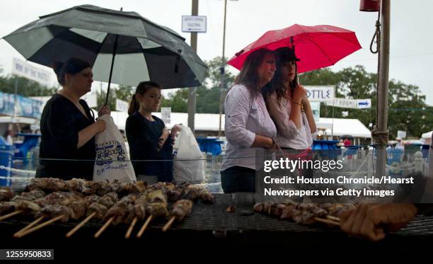 Sheri Heine left, her daughter Sophie Heine , Elaine Makris, and her daught Tara Makris wait in line for Souvlaki during the 45th Greek Festival...