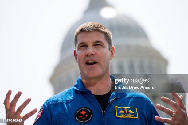 Canadian Space Agency astronaut Jeremy Hansen speaks during a news conference about the NASA's Artemis II mission outside the U.S. Capitol May 18,...