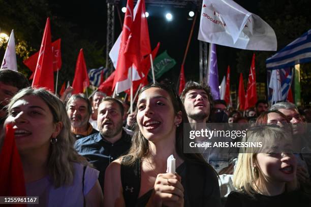 Supporters of Greek opposition leader of Syriza party attend a pre-election speech in Athens on May 18 ahead of Greece's general elections on May 21....