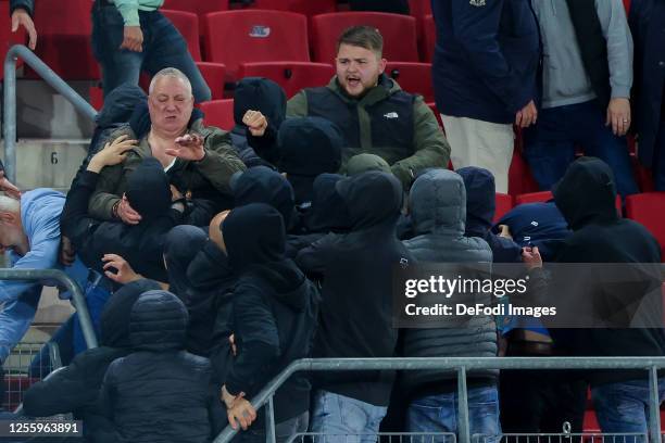 Fans of West Ham United and family of players fighting , AZ supporters looks on after the UEFA Europa Conference League semi-final second leg match...