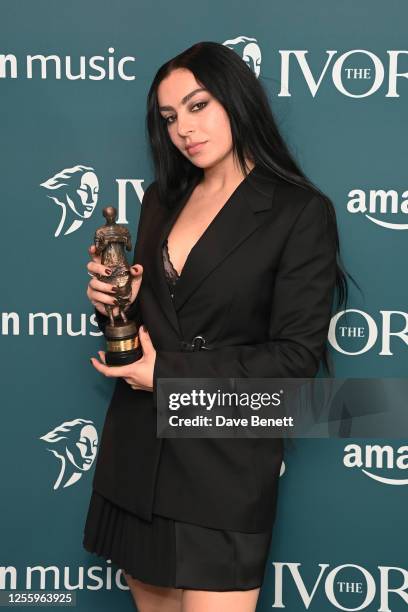 Charli XCX, winner of the Visionary Award with Amazon Music, poses in the winners room at The Ivors 2023 at The Grosvenor House Hotel on May 18, 2023...