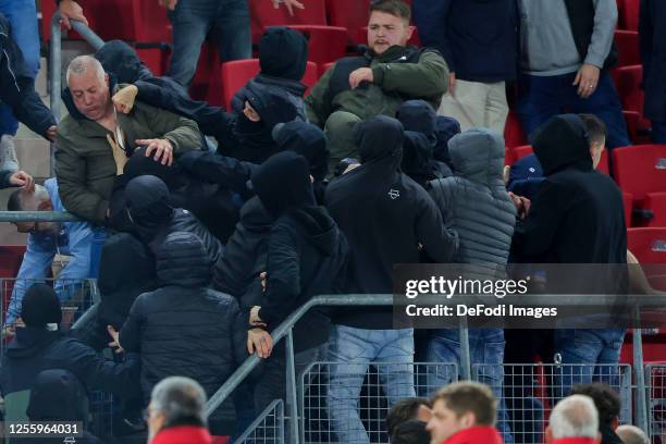 Fans of West Ham United and family of players fighting , AZ supporters looks on after the UEFA Europa Conference League semi-final second leg match...