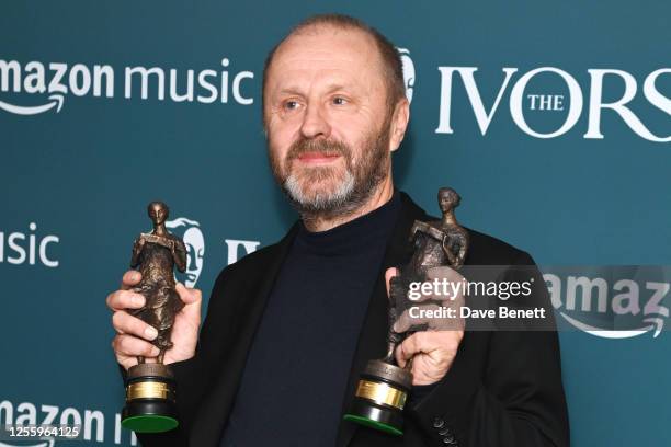 Martin Hall, accepting the Best Songwriter Of The Year awards on behalf of Wet Leg, poses in the winners room at The Ivors 2023 at The Grosvenor...