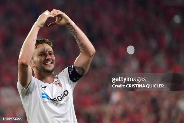 Sevilla's Croatian midfielder Ivan Rakitic celebrates his team's qualification for the final after winning the UEFA Europa League semi-final second...