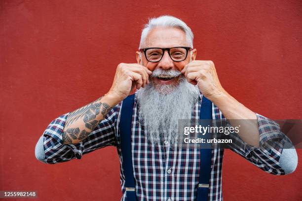 handsome senior man handlebar mustache - handlebar moustache stock pictures, royalty-free photos & images
