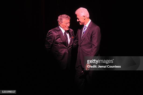 Tony Bennett and former President of the United States Bill Clinton greet onstage during Tony Bennett's 85th Birthday Gala Benefit for Exploring the...