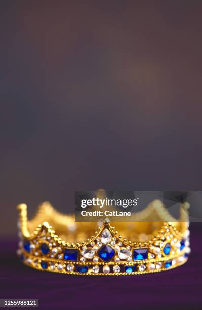 gold jeweled crown on velvet - royalty crown stock pictures, royalty-free photos & images