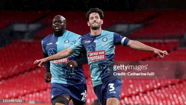 Joe Jacobson of Wycombe Wanderers celebrates with Adebayo Akinfenwa of Wycombe Wanderers after he scores from the penalty spot during the Sky Bet...