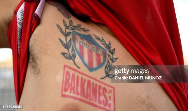 Fan of Junior shows his tattoos before a football match between Junior and Pereira at Metropolitano stadium in Barranquilla, Colombia on May 13,...