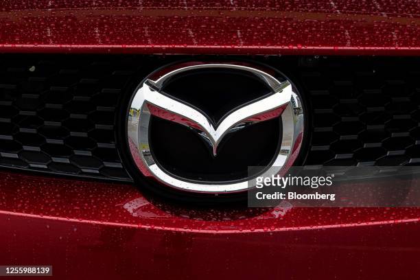 Mazda Motor Corp. Badge on a MX-30 electric vehicle displayed during a Japan Automobile Manufacturers Association event on sidelines of the Group of...