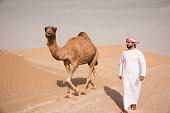 arab man walking in the desert