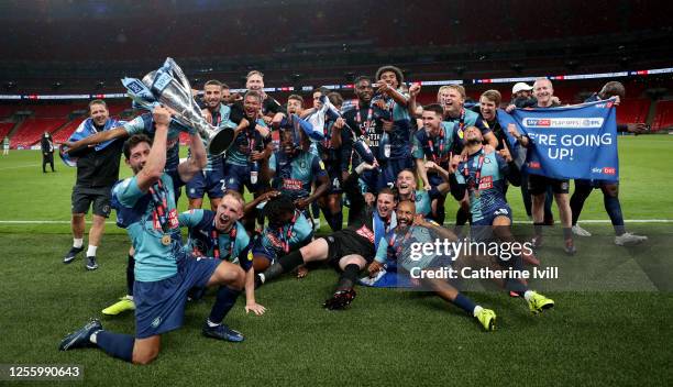 Wycombe Wanderers players celebrate after the Sky Bet League One Play Off Final between Oxford United and Wycombe Wanderers at Wembley Stadium on...