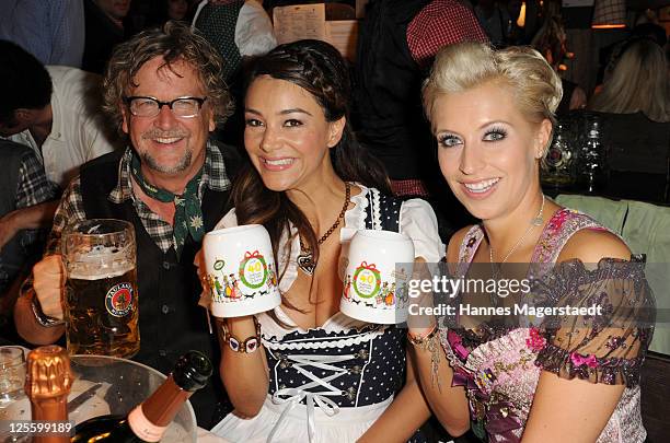 Martin Krug, Verona Pooth and Verena Kerth attend the Oktoberfest beer festival at Kaefer Schaenke beer tent on September 17, 2011 in Munich, Germany.