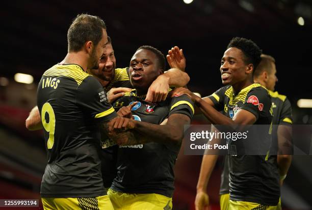 Michael Obafemi of Southampton celebrates with teammates after scoring his team's second goal during the Premier League match between Manchester...