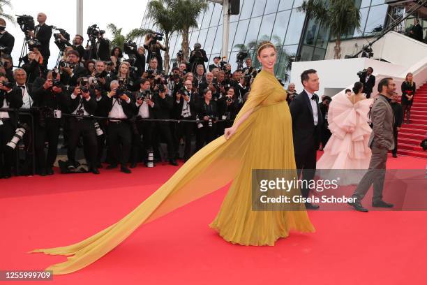 Karlie Kloss attends the "Indiana Jones And The Dial Of Destiny" red carpet during the 76th annual Cannes film festival at Palais des Festivals on...